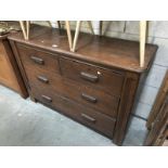 An Edwardian oak chest of 2 over 2 drawers.