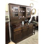 An oak lead glazed dresser.