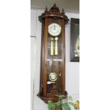 A mahogany double weight wall clock.