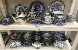 2 shelves of blue and white china.