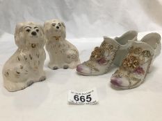 A pair of Royal Doulton miniature Staffordshire spaniels and a pair of porcelain shoes.