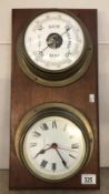 A clock and barometer set on a wooden wall mount.