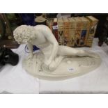 A reconstituted marble figure 'The Dying Gaul'.