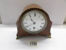 An inlaid mantel clock.