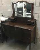 An Edwardian inlaid mahogany mirror back dressing table.