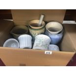 A mixed lot of ceramic vases and pots.
