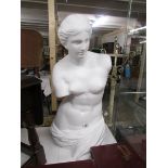 A Venus de Milo figure.