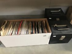 A box and 2 cases of 45rpm single records.