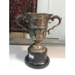 A silver trophy on stand inscribed "Sheffield Telegraph Golf Cup 1932", hall marked Walker and Hall,