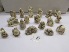 18 Oriental resin figures including some erotic.