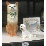 A boxed Regency Fine Arts West Highland terrier and a china model of a ginger cat.