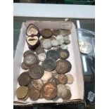 A mixed lot of coins including silver and £5 coins.