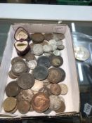 A mixed lot of coins including silver and £5 coins.