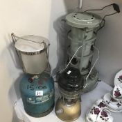 A Tilley pressure lantern , Aladdin parafin heater and campingaz lamp.