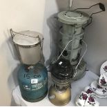 A Tilley pressure lantern , Aladdin parafin heater and campingaz lamp.