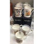 A quantity of Aynsley commemorative tankards, mostly boxed.