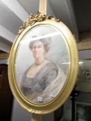 An oval gilt framed portrait of a lady entitled 'Bethia Clarke'.