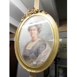 An oval gilt framed portrait of a lady entitled 'Bethia Clarke'.