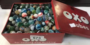 A box of various marbles.