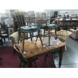 A pine kitchen table and 4 chairs.