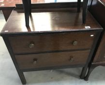 An Edwardian oak 2 drawer chest.