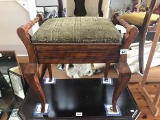 An Edwardian piano stool.