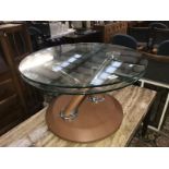 A round glass topped table