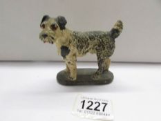 A 1930's cold painted bronze terrier stamped 'Chorus Brand, London'.