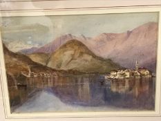 A framed and glazed watercolour of mountains and lake.