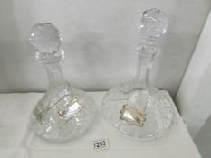 2 fine cut crystal ship's decanters with 3 white metal labels.
