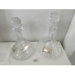 2 fine cut crystal ship's decanters with 3 white metal labels.