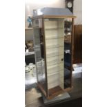 A rotating shop display cabinet.