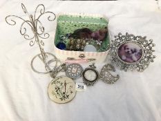 A mixed lot of photo frames, bracelets etc.