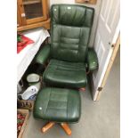 A green leather swivel chair and stool.
