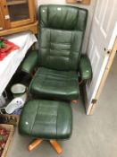 A green leather swivel chair and stool.