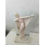 An art deco style figural table lamp.