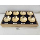 A cased set of 8 gold plated sake' bowls.