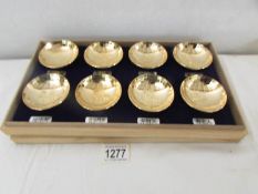 A cased set of 8 gold plated sake' bowls.