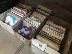 3 boxes of 45rpm singles records.