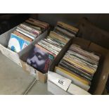 3 boxes of 45rpm singles records.