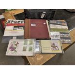 A large quantity of mint presentation packs and a stamp album.