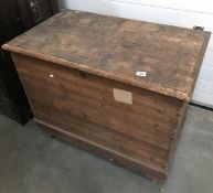 A large wooden blanket box.