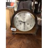 An oak cased Smith's mantel clock.