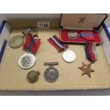 A cased Imperial Service medal, a WW2 Defence medal, a 1930-45 Star, 2 1902 Coronation medals,