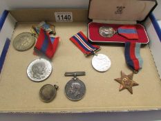 A cased Imperial Service medal, a WW2 Defence medal, a 1930-45 Star, 2 1902 Coronation medals,