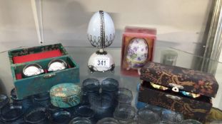 2 boxes of pairs of Chinese stress balls, decorative musical faberge style egg etc.