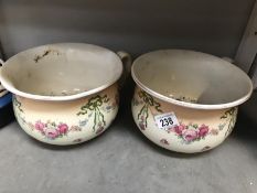 A pair of Staffordshire chamber pots.