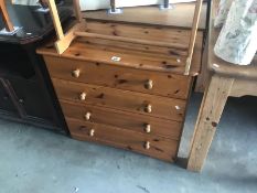 A pine 4 drawer chest of drawers.