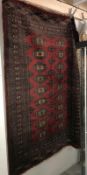 A medium sized red patterned Eastern rug