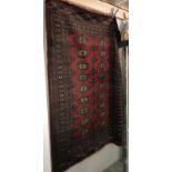 A medium sized red patterned Eastern rug